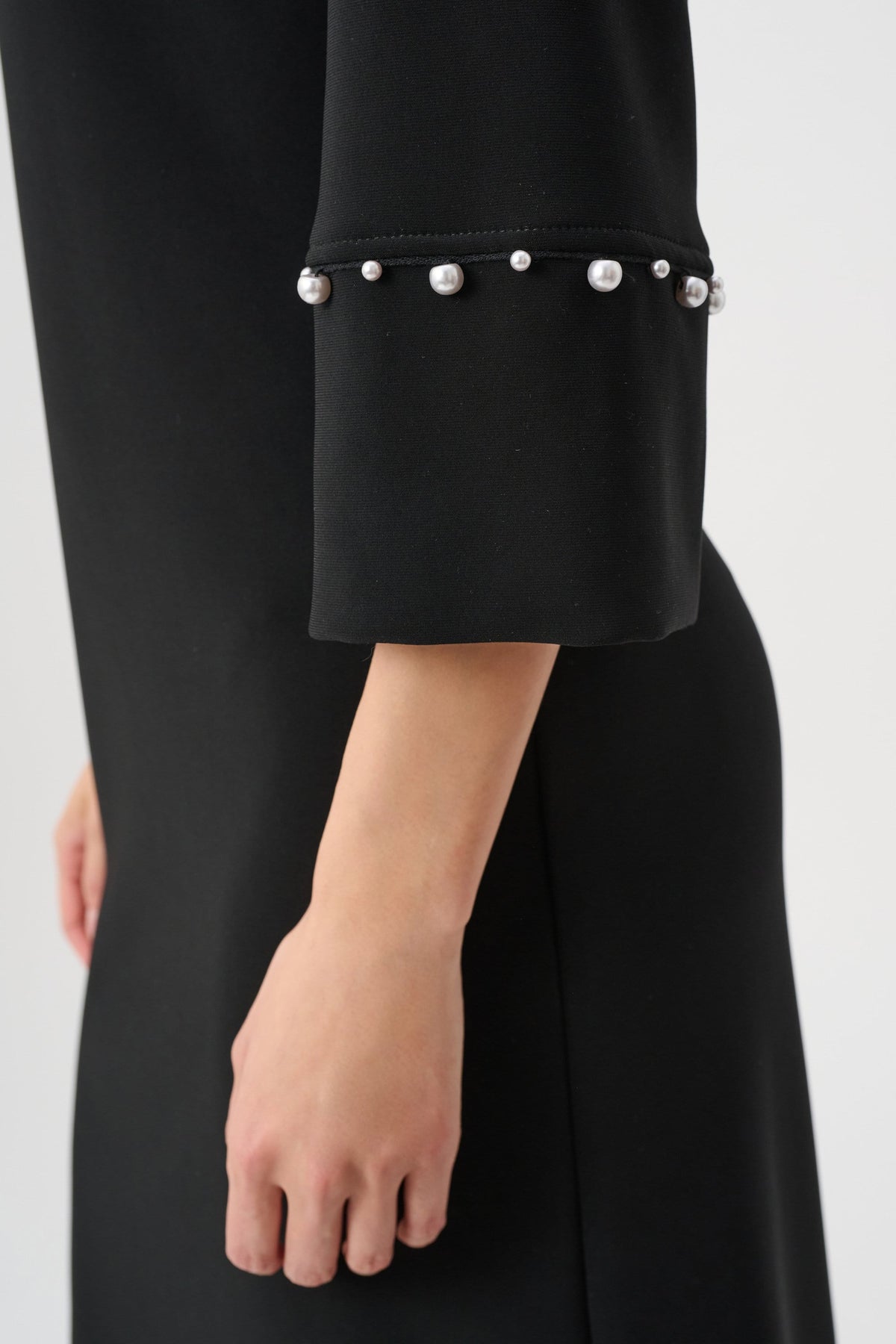 Close-up of fabric, sleeve, trim or fastening on Joseph Ribkoff A-Line Dress With Pearl Detail in Black, style 263115