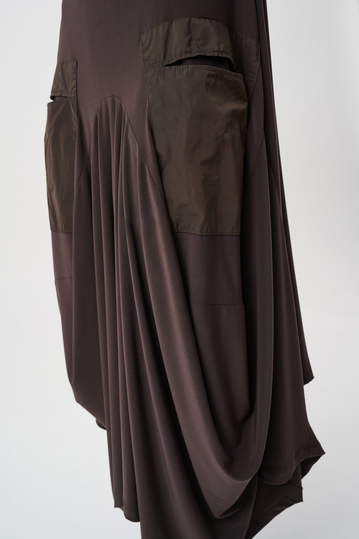 Close-up of waist, sleeve or fabric detail on Joseph Ribkoff Draped Quarter-Zip Midi Dress in Mocha, style 263159