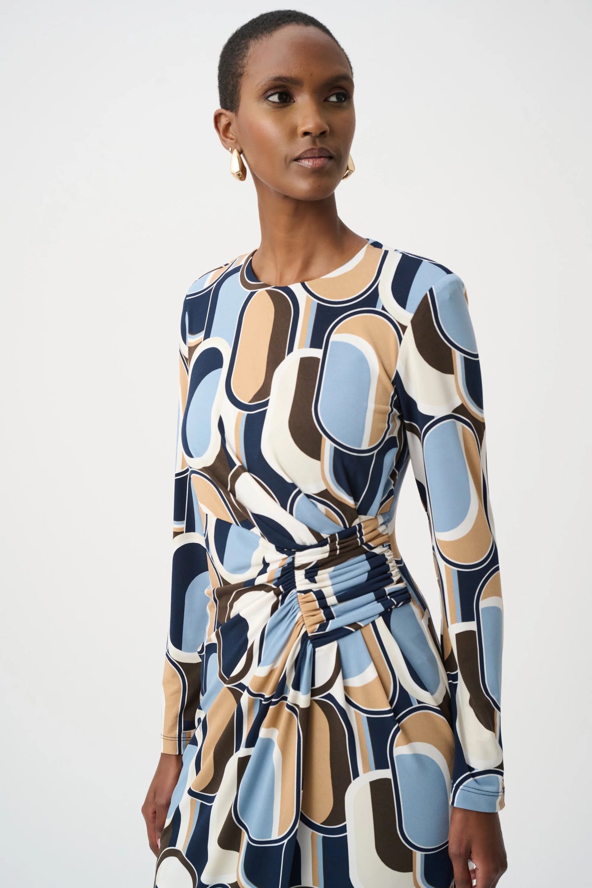 Close-up of waist, sleeve or fabric detail on Joseph Ribkoff Silky Knit Printed Wrap Dress in Off-White/Multi, style 263218