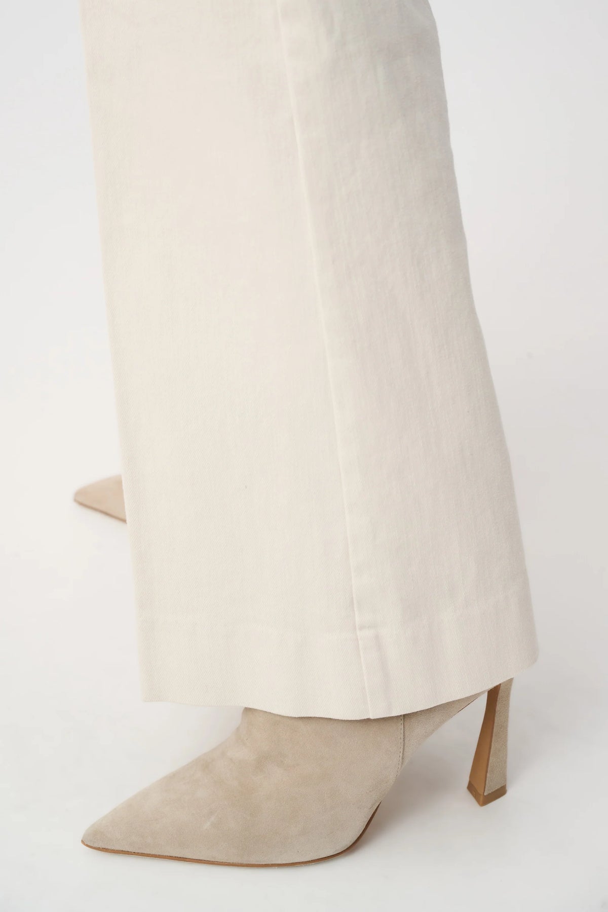 Close-up of fabric and leg detailing on Joseph Ribkoff Chloe Stretch Denim High-Rise Wide-Leg Jeans in Birch, style 263902 and cuff 