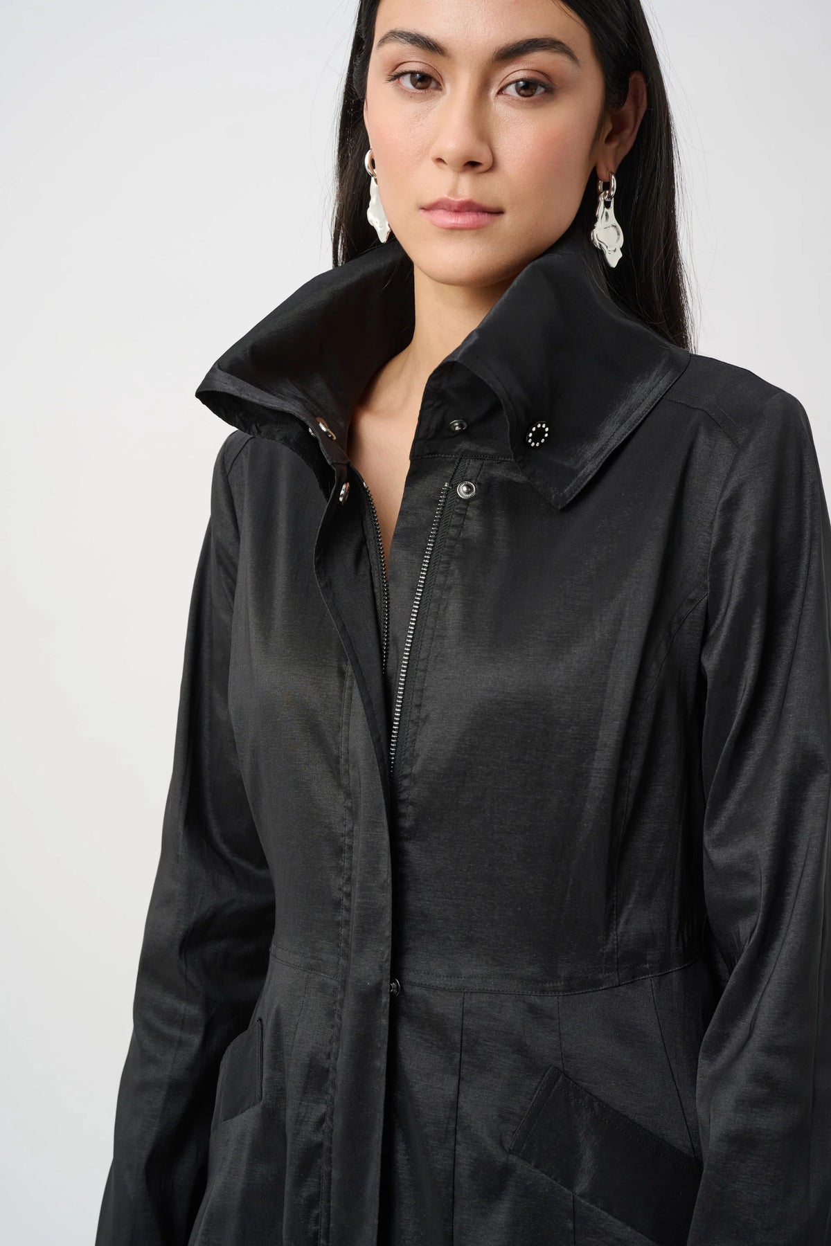 Close-up of fabric texture and trim on Joseph Ribkoff Stretch Taffeta Belted Fit & Flare Balloon Coat in Black, style 263911