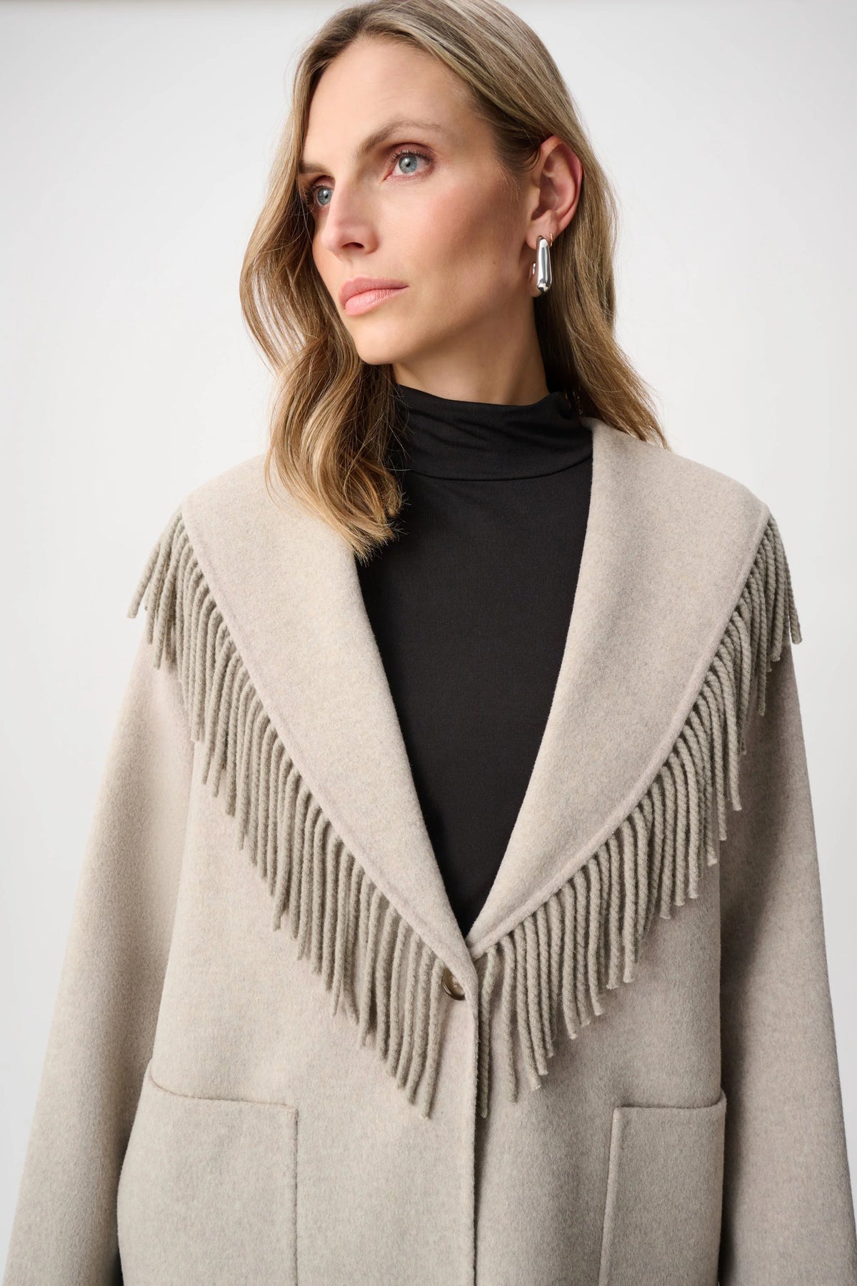 Close-up of collar and fastening details on Joseph Ribkoff Wool Blend Fringed Coat in Oatmeal, style 263912