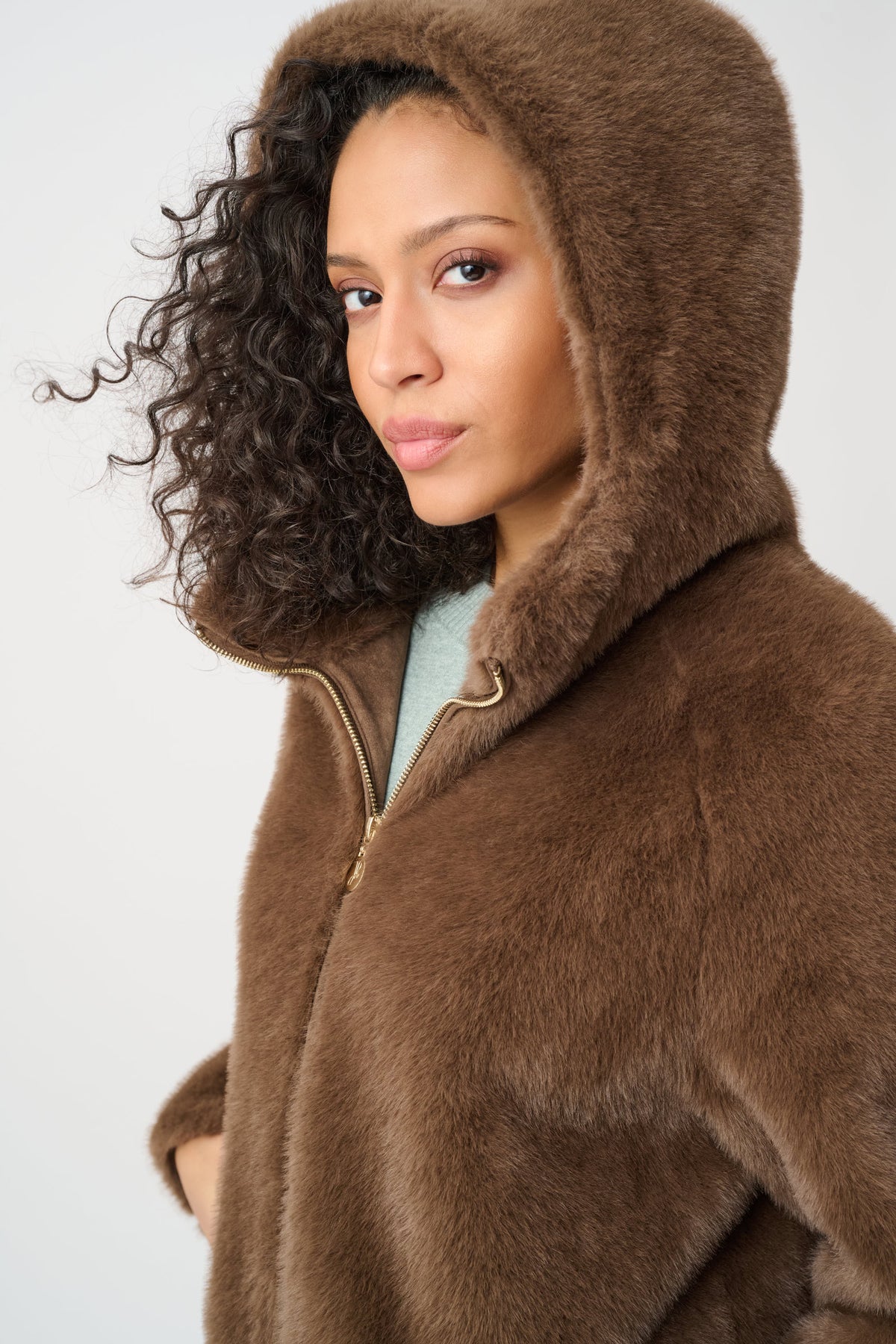 Close-up of collar and fastening details on Joseph Ribkoff Faux Fur Hooded Coat in Dark Mink, style 263914