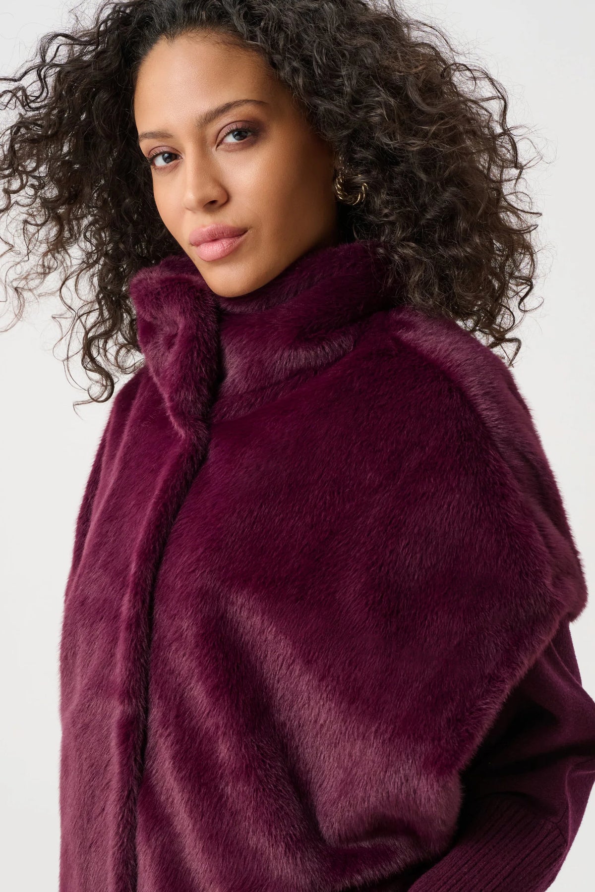 Joseph Ribkoff Faux Fur Funnel Neck Boxy Vest in Elderberry, style 263918 shown at a three-quarter angle