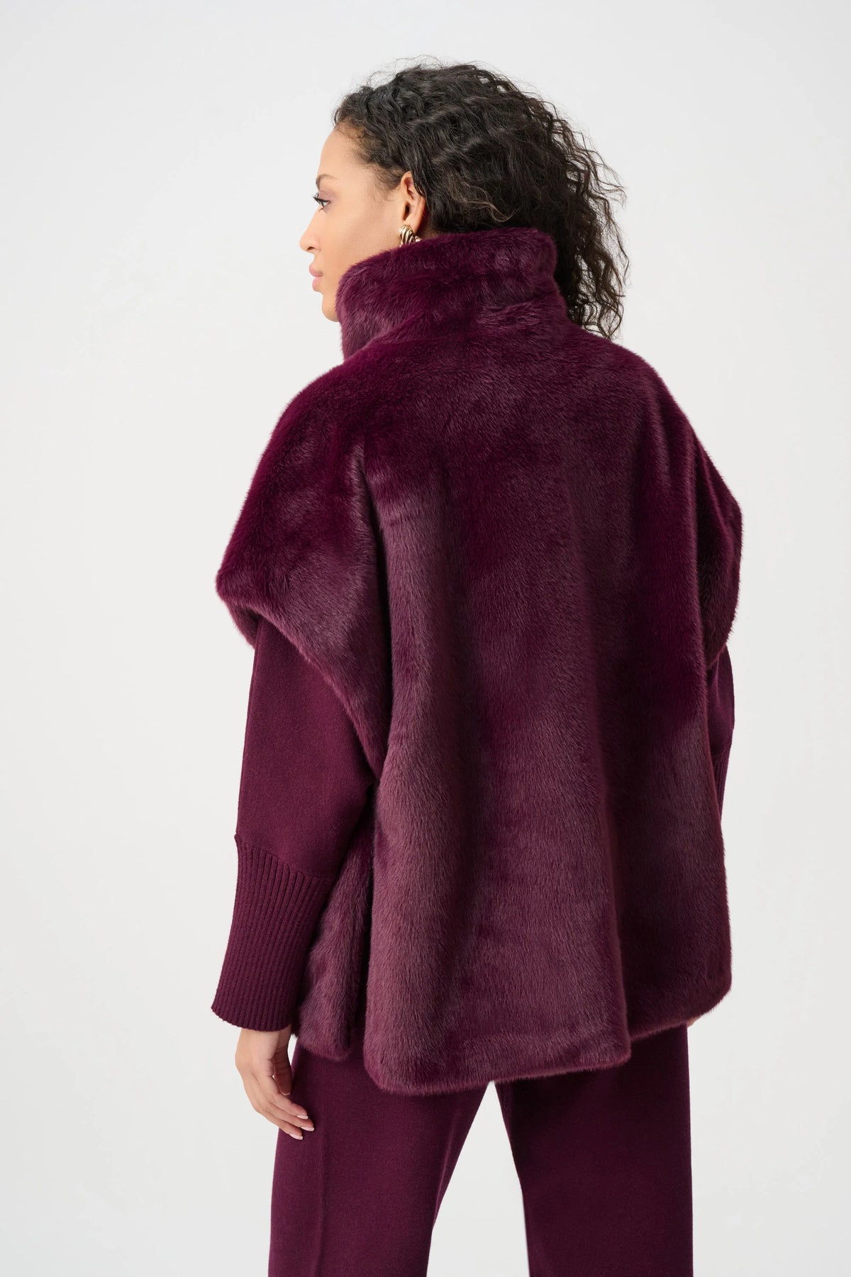 Joseph Ribkoff Faux Fur Funnel Neck Boxy Vest in Elderberry, style 263918 shown from the back