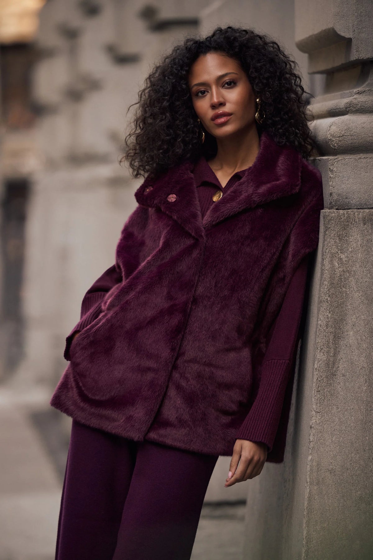 Full styled view featuring Joseph Ribkoff Faux Fur Funnel Neck Boxy Vest in Elderberry, style 263918 in berry
