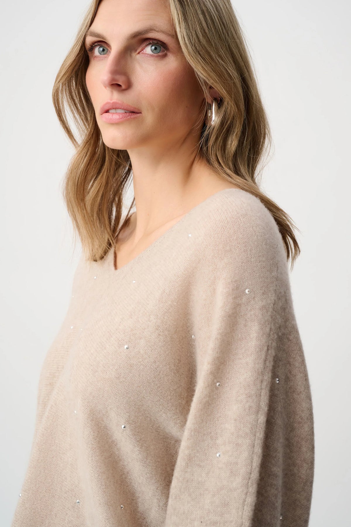 Close-up of neckline and upper-body details on Joseph Ribkoff Cashmere Boxy Sweater With Rhinestone Detail in Oatmeal Melange, style 263940