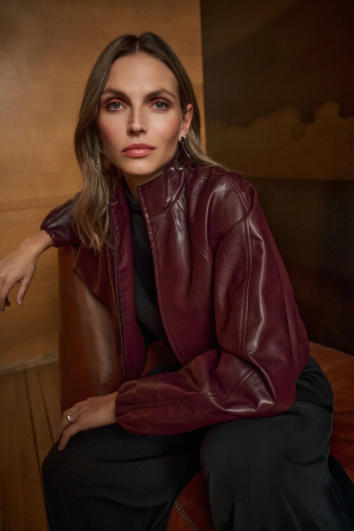 Joseph Ribkoff Leatherette Mock-Neck Bomber Jacket in Burgundy, style 263971 shown at a three-quarter angle