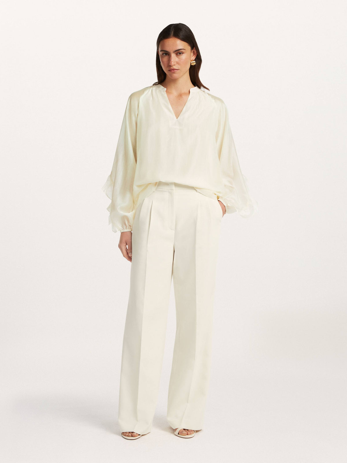 Beaumont Amanda Blouse in cream styled on model with wide-leg trousers