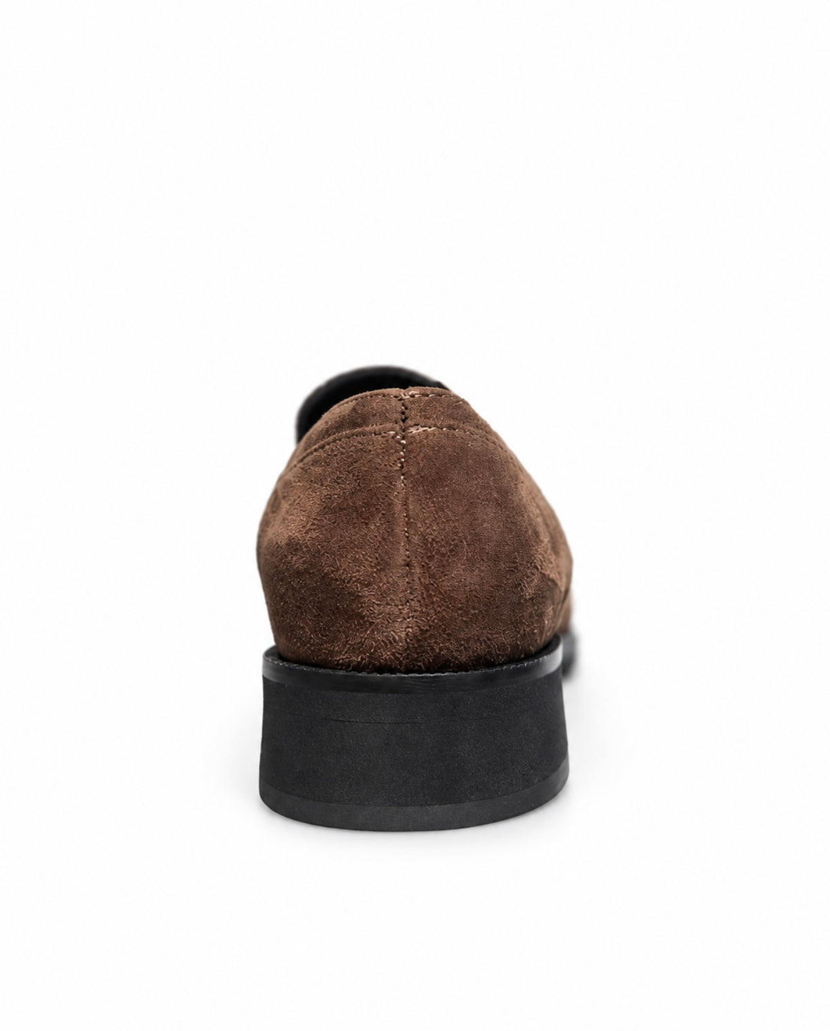 A single brown suede loafer shown from a rear three-quarter view, featuring a thick black platform sole, set against a plain white background.