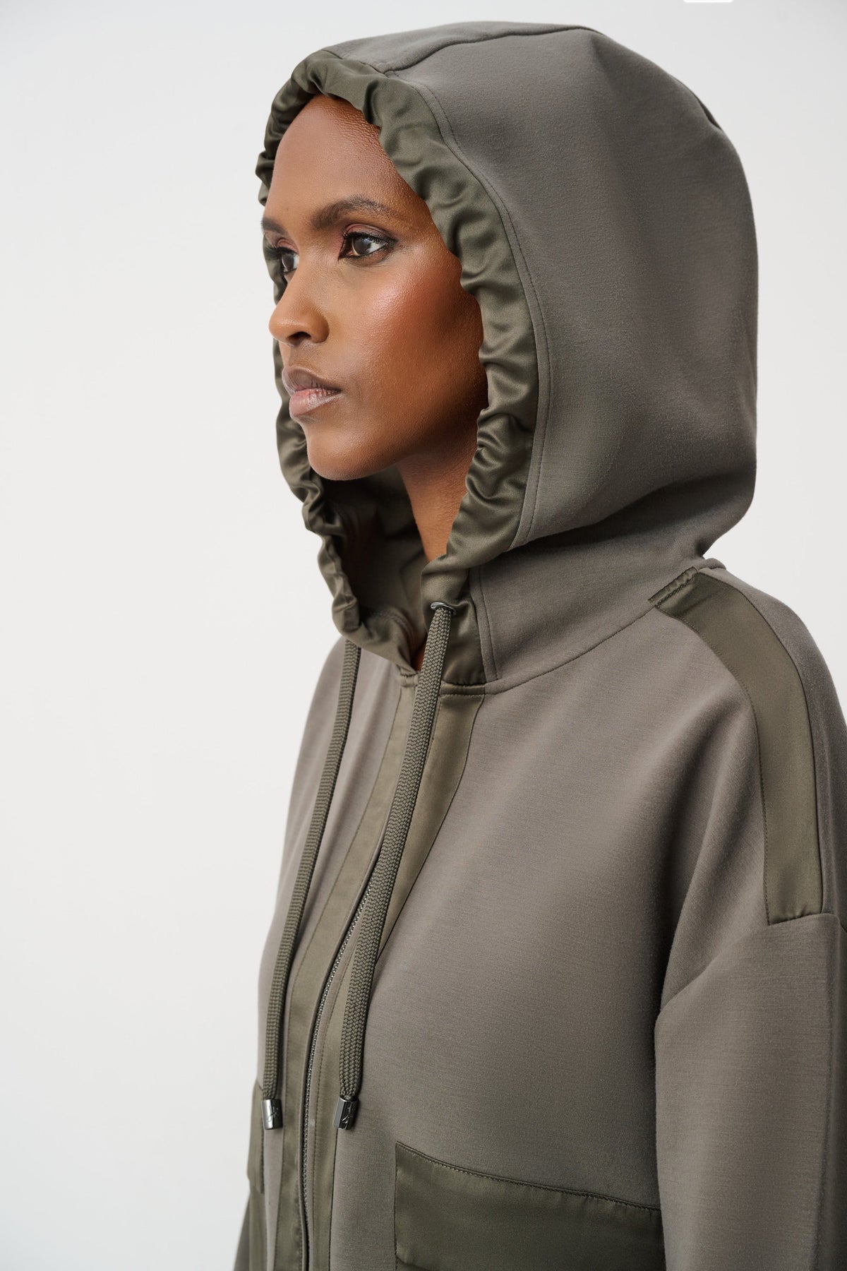 Joseph Ribkoff Scuba Jersey & Satin Hooded Boxy Jacket in Avocado, style 263624 shown from the side with hood