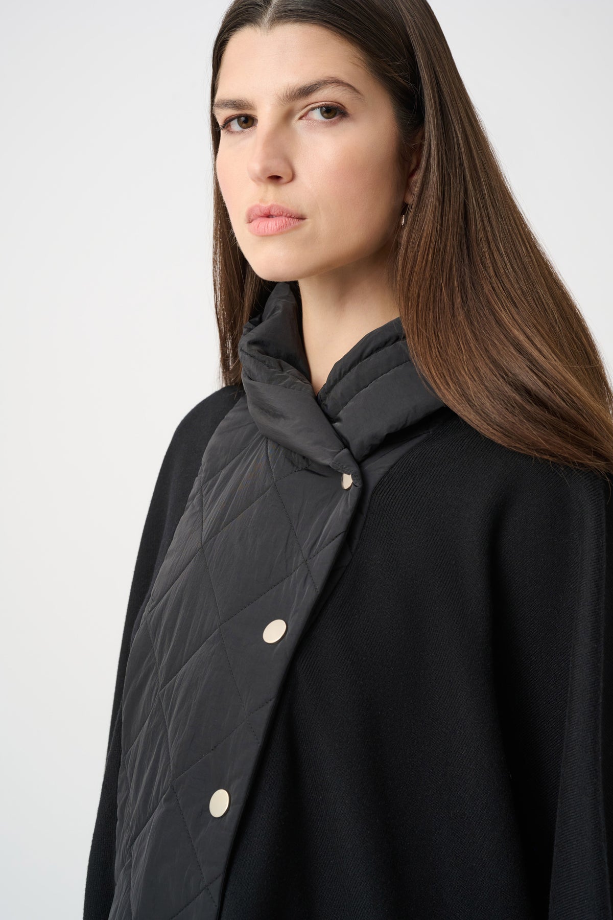 Close-up of neckline and upper-body details on Joseph Ribkoff Quilted Poncho Jacket in Black, style 263627