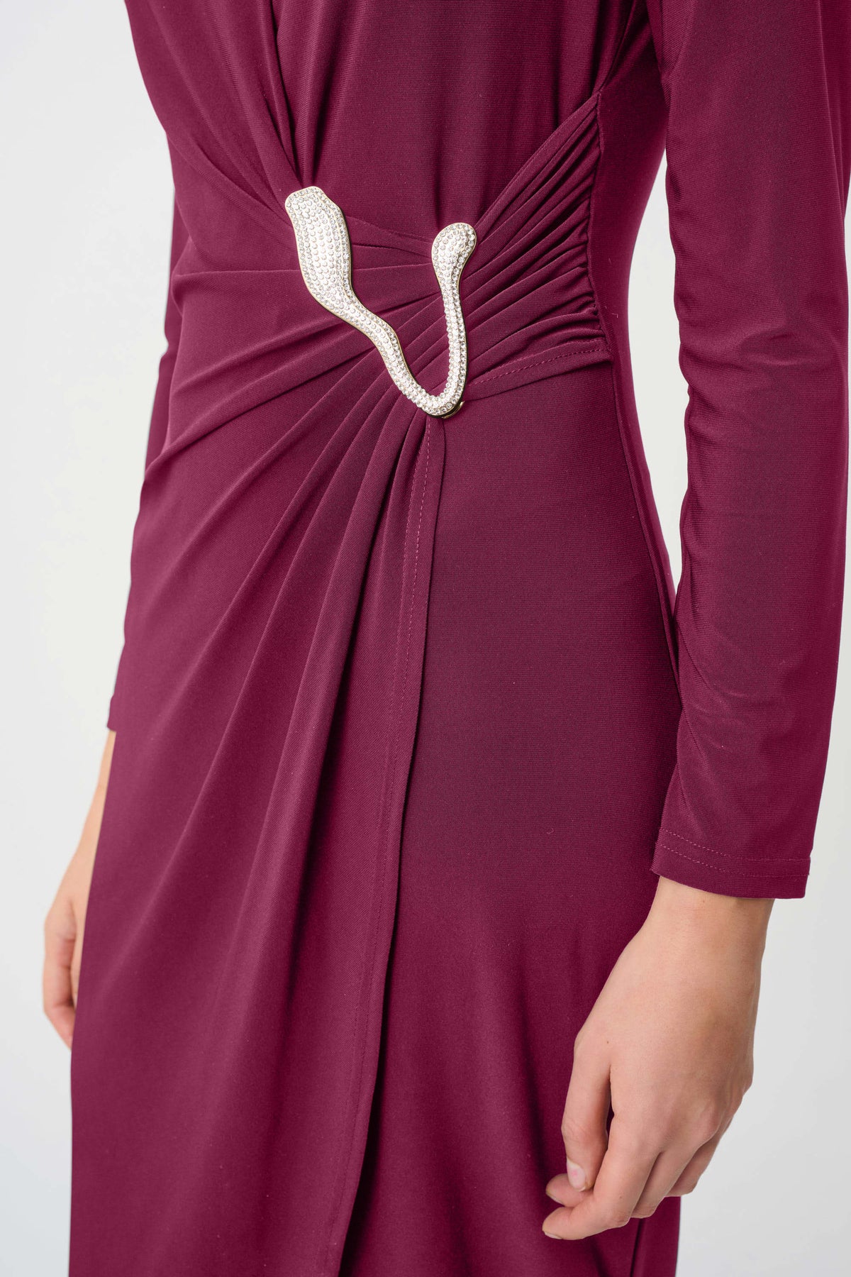 Close-up of ruching rhinestone ion Joseph Ribkoff Silky Knit Sheath Wrap Dress in Berry, style 263709