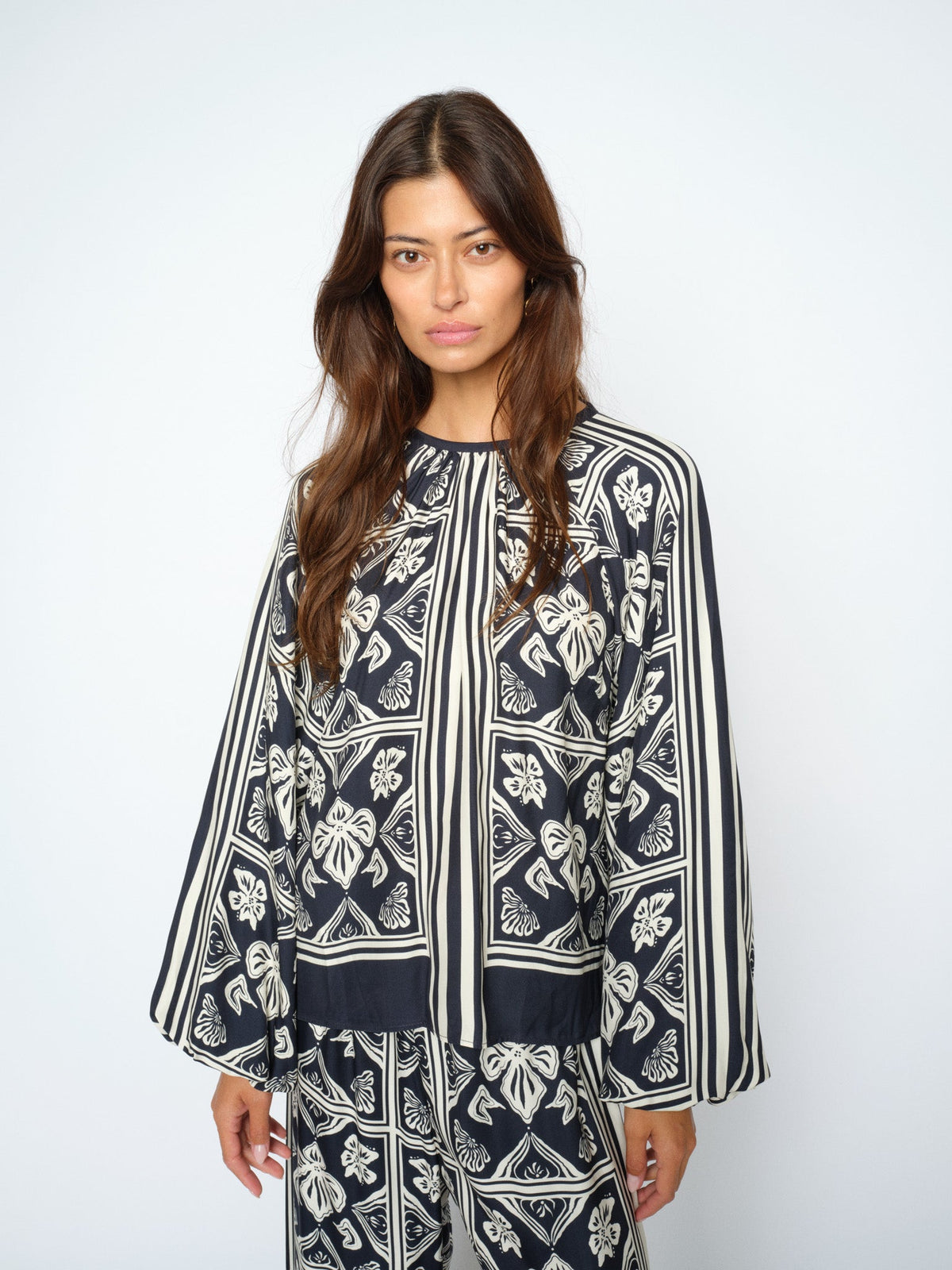 Model wearing MMMilkey Linocut blouse in navy model pose