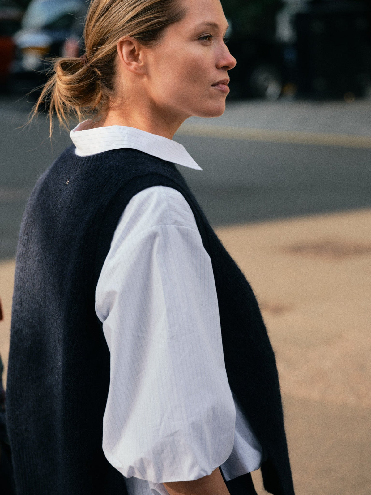 Mos Mosh navy alpaca vest layered over a white shirt