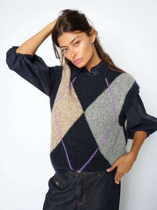Model wearing Mos Mosh Jennine argyle knit vest in Salute Navy